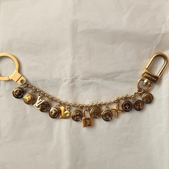 LOUIS VUITTON - AUTHENTIC, VINTAGE, AND RARE LOGO CHARM BRACELET - Picture 1 of 10